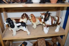 THREE POTTERY SPANIELS AND A POTTERY CARTHORSE (4)