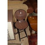 TWO FOLDING METAL FRAMED STOOLS OR STANDS