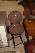 TWO FOLDING METAL FRAMED STOOLS OR STANDS