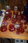 COLLECTION OF CRANBERRY GLASS ITEMS TO INCLUDE DECANTERS, DRINKING GLASSES, JUGS, SUGAR SIFTER ETC