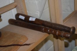 TWO WOODEN TRUNCHEONS