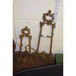 TWO BRASS TABLE EASELS WITH FOLIATE DECORATION