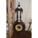 LATE VICTORIAN ANEROID BAROMETER AND THERMOMETER COMBINATION IN FLORAL CARVED FRAME