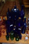 COLLECTION OF BLUE GLASS ITEMS TO INCLUDE CHEMISTS BOTTLES, NOVELTY WINE BOTTLES, VASES, GREEN GLASS