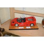 MODEL FERRARI ON POLISHED WOODEN BASE