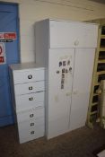 WHITE MELAMINE THREE DOOR WARDROBE AND A PAIR OF WHITE MELAMINE BEDSIDE CABINETS, LARGEST PIECE