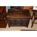 SMALL 20TH CENTURY DARK OAK BLANKET BOX, THE FRONT WITH CARVED DECORATION, 55CM WIDE