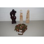 PAIR OF MODERN POLISHED STONE OBELISKS, HARDWOOD FRUIT DECORATED WALL PLAQUE AND A POLISHED WOODEN