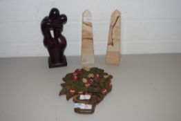 PAIR OF MODERN POLISHED STONE OBELISKS, HARDWOOD FRUIT DECORATED WALL PLAQUE AND A POLISHED WOODEN