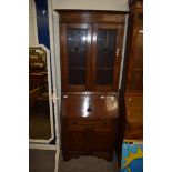 EARLY 20TH CENTURY OAK BUREAU BOOKCASE CABINET WITH LEAD GLAZED TOP SECTION OVER A BASE WITH FALL