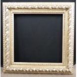 A modern bevelled edged rectangular picture frame, approx 25 x 34ins