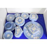 COLLECTION OF WEDGWOOD BLUE JASPERWARE TO INCLUDE ASHTRAYS, CUP AND SAUCER, COVERED TRINKET BOXES