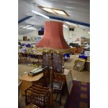 20TH CENTURY STANDARD LAMP WITH FLORAL CARVED DETAIL AND PINK SHADE