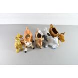 COLLECTION OF FOUR MODERN COW CREAMERS AND A FURTHER COW ORNAMENTS (5)