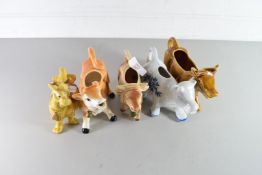 COLLECTION OF FOUR MODERN COW CREAMERS AND A FURTHER COW ORNAMENTS (5)