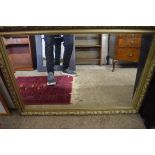 MODERN BEVELLED WALL MIRROR IN GILT FINISH FRAME, 102CM WIDE