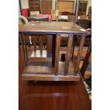 EARLY 20TH CENTURY OAK REVOLVING TABLE TOP BOOK RACK, 36CM WIDE