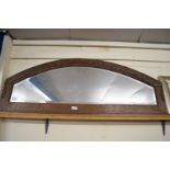 OAK FRAMED ARCHED OVERMANTEL MIRROR DECORATED WITH CARVED DETAIL