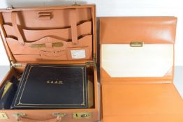 BROWN LEATHER TRAVELLING BRIEFCASE OR STATIONERY CASE CONTAINING VARIOUS NOTEBOOKS, RING BINDER