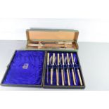 CASED CARVING SET AND A CASED SET OF CUTLERY