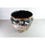 LARGE MAJOLICA TYPE GLAZED JARDINIERE DECORATED WITH CHERUBS, NO 422 TO BASE