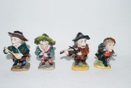 Four 20th century Naples pottery dwarves 9cm in height