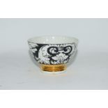 Small bowl decorated in black and white with a design by Fornisetti,