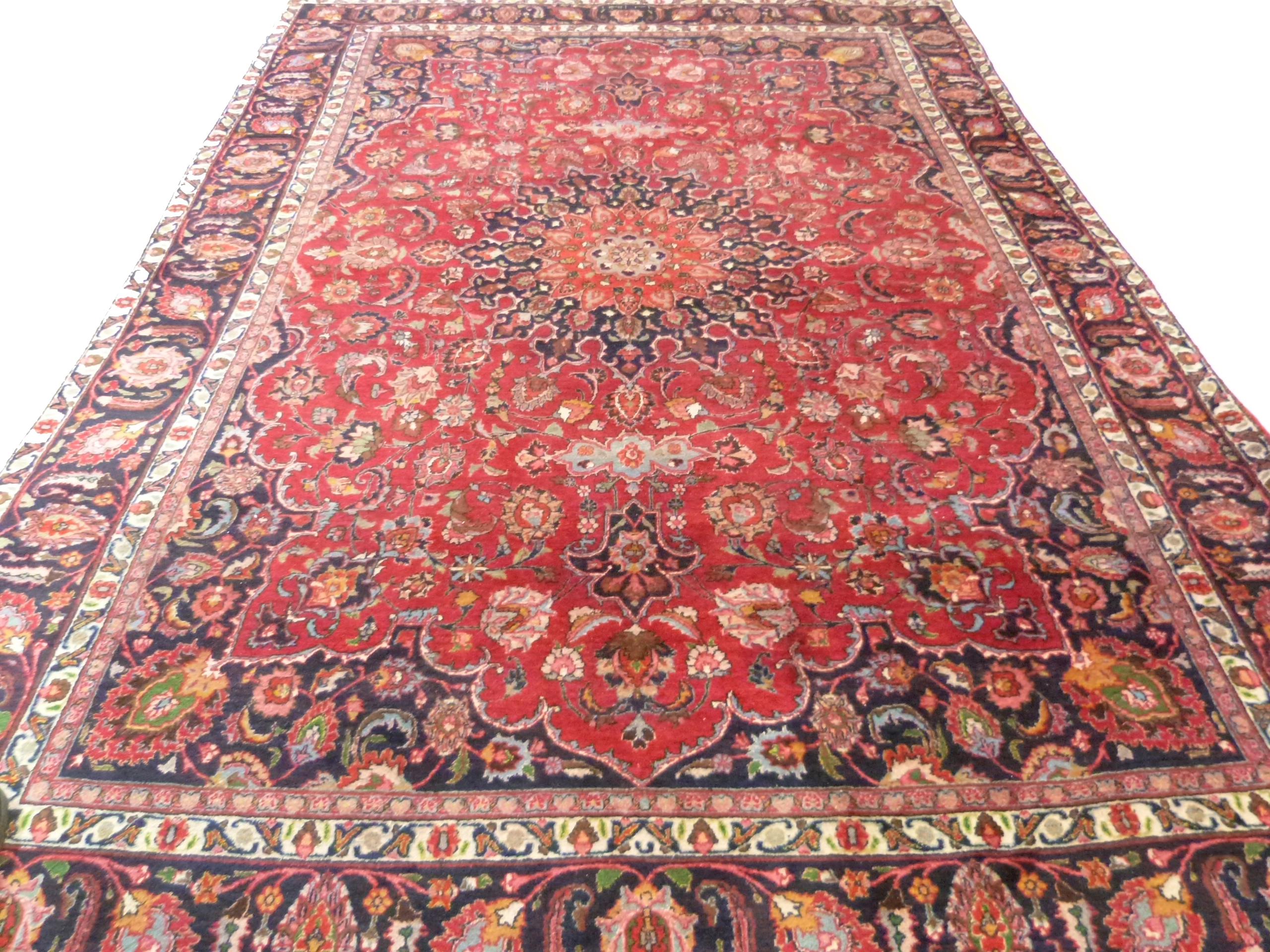 Large red ground Persian Mashad Carpet, mutlicoloured with traditional design 388cm x 270cm approx