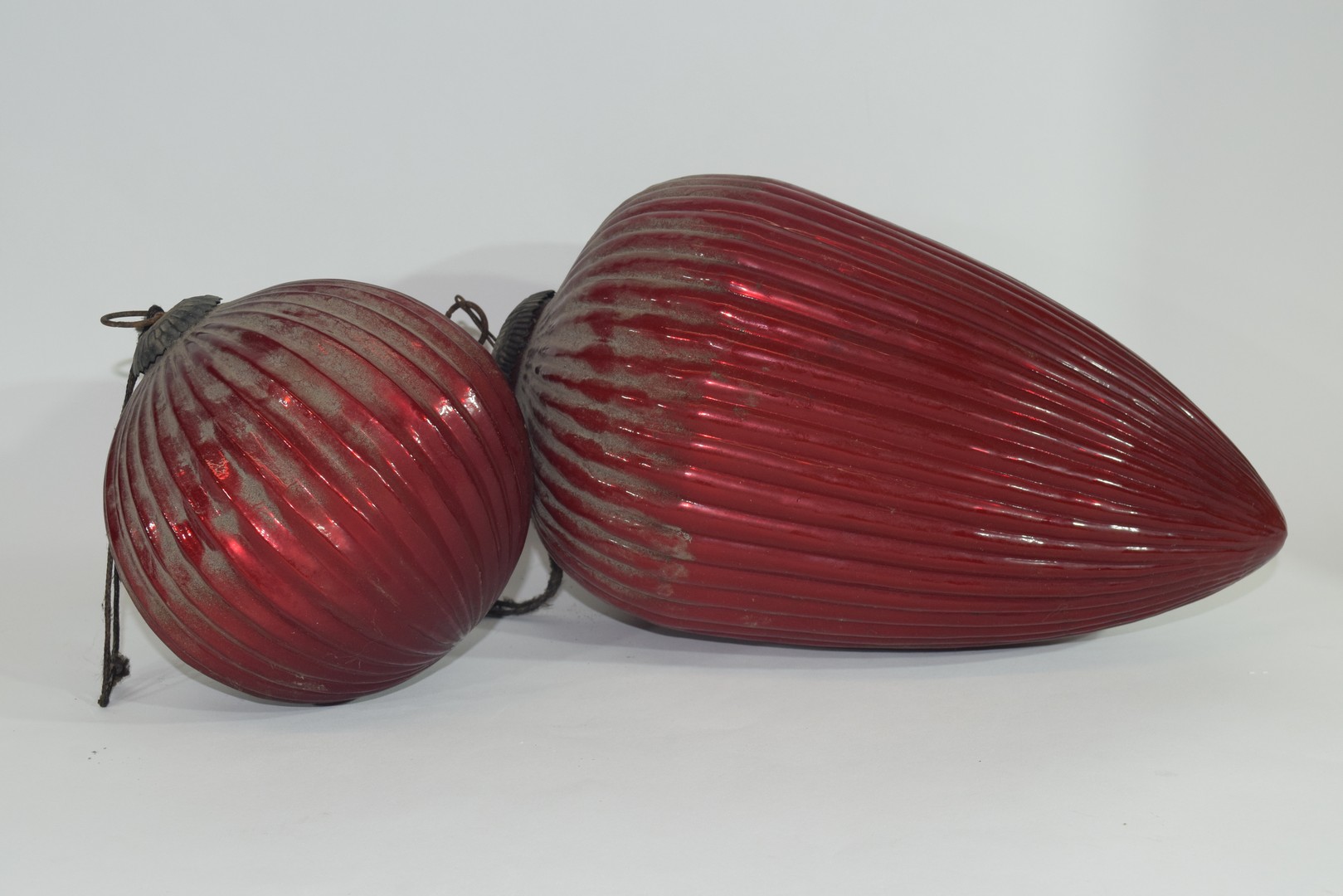 Two red glass Oriental lanterns