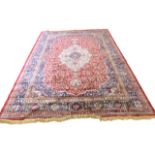 Large red ground full-pile Kashmir Carpet, floral medallion design, 340cm x 230 cm approx