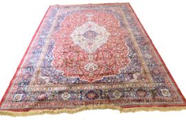 Large red ground full-pile Kashmir Carpet, floral medallion design, 340cm x 230 cm approx