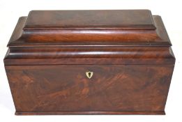 Georgian mahogany sarcophagus formed tea caddy, the hinged lid opening to an interior with two