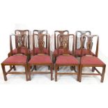A set of eight 19th century mahogany dining chairs with pierced splat backs and red upholstered push