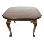 Georgian style small mahogany extending dining table with extra leaf raised on cabriole legs,
