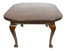 Georgian style small mahogany extending dining table with extra leaf raised on cabriole legs,