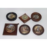 Group of pot lids on wooden mounts