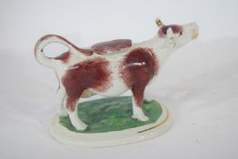 Pottery model of a cow creamer