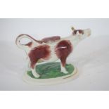 Pottery model of a cow creamer