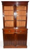 Full height mahogany side cabinet with glazed bookcase raised over double cupboard, width approx