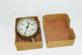 Small brass cased pressure gauge