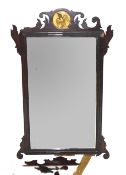 19th century wall mirror in mahogany fret work frame with central gilded roundel detail with bird,