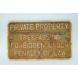 Vintage cast iron plaque marked "Private property. Trespassing forbidden under penalty of law"