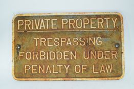 Vintage cast iron plaque marked "Private property. Trespassing forbidden under penalty of law"