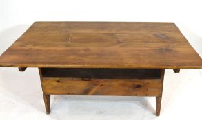 Unusual 20th century stained pine kitchen table, the rectangular top with pegged attachment to a