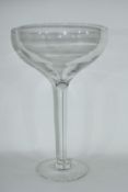 Large clear glass bowl raised on plain stem and foot