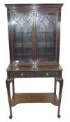 Edwardian mahogany side cabinet with shaped cornice over a top section with two glazed doors and