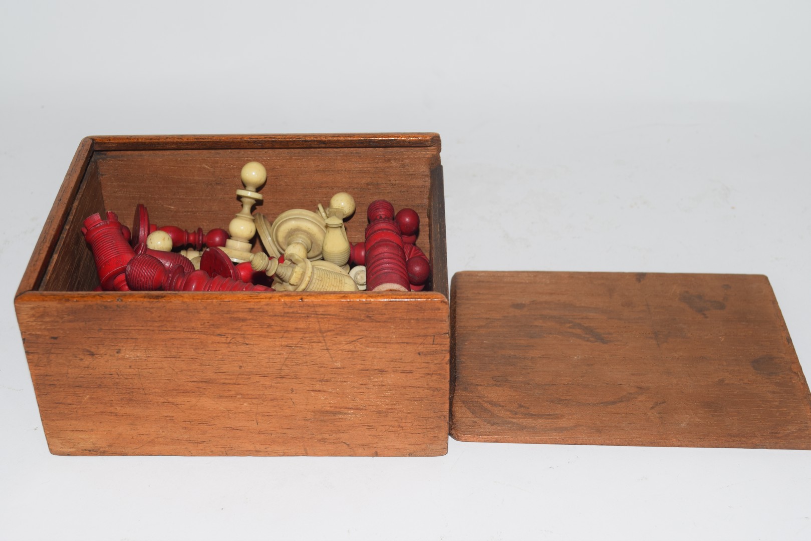 19th century ivory and red stained ivory part chess set