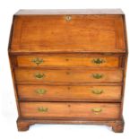 George III faded mahogany bureau with fall front opening to a shelved interior over four long