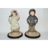 Pair of late 19th century Continental bisque figures of a boy and girl