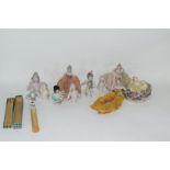 A collection of various continental porcelain pin cushion dolls to include examples in dress, a